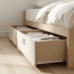 Low-profile under-bed storage drawers sliding out from beneath a modern bed