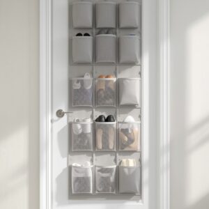 Multi-pocket hanging over-the-door organizer on a white door holding shoes and toiletries