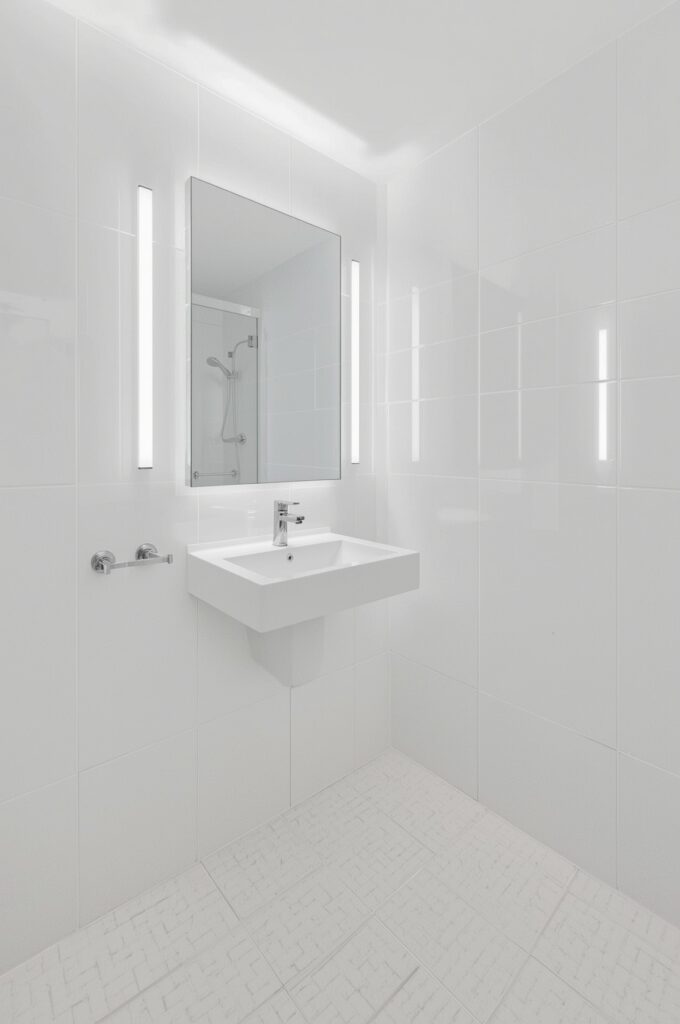 All-White Tiles with Matching Grout for Seamless Surfaces